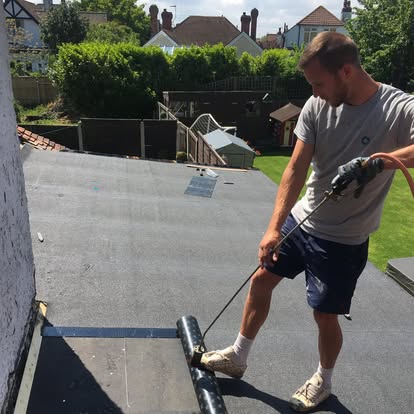 Cooper Roofing specialist working on flat roof installation